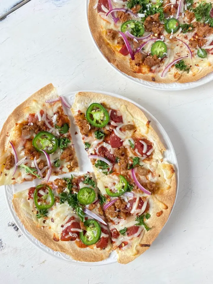 tortilla pizza with sausage, kale, and jalapeno 